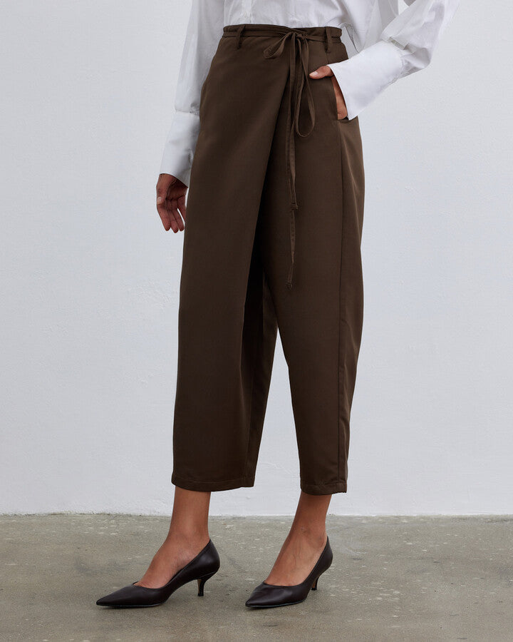 Introducing the Brown Fold Trousers, a versatile addition to your wardrobe. These trousers combine classic style with modern sophistication, featuring a flattering fit and timeless brown hue. Ideal for both casual and formal settings, they offer comfort and elegance in one. Crafted from high-quality materials, the Brown Fold Trousers ensure durability and a polished look. Elevate your outfit with this essential piece that seamlessly blends style and versatility for every occasion.