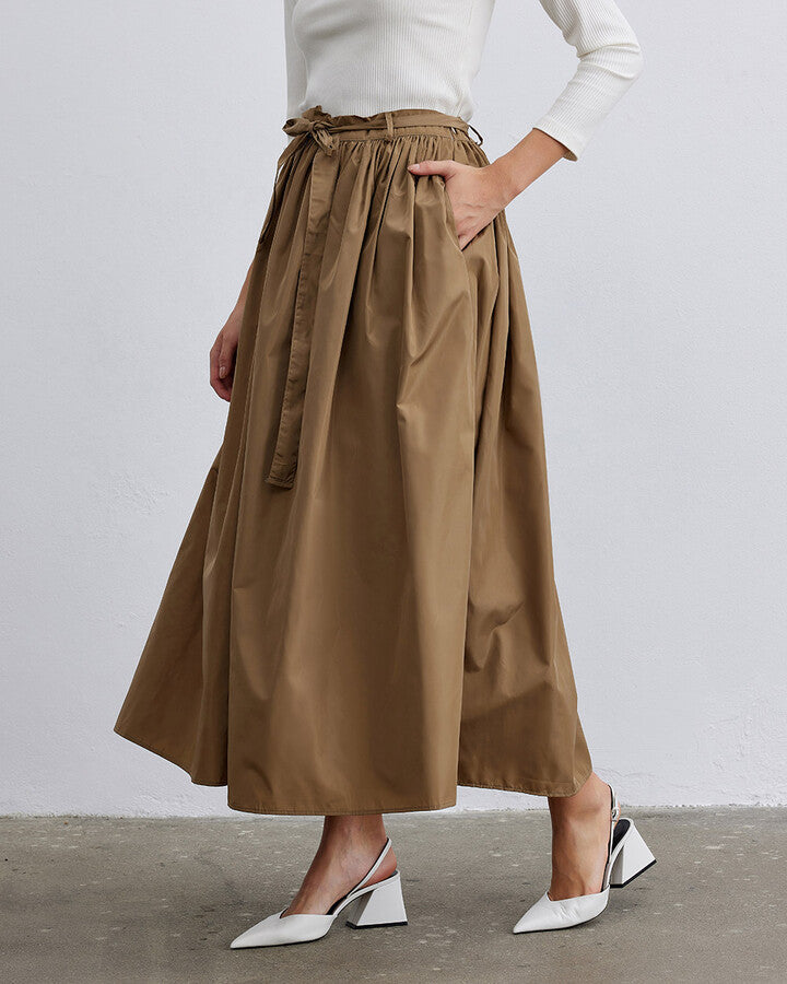 Elevate your style with the Camel Glory Gathered Balloon Skirt. This fashionable skirt features a luxurious camel hue and a unique gathered design that adds volume and flair. Perfect for any occasion, the balloon silhouette offers a modern twist on classic elegance. Made with high-quality materials for a comfortable fit, the Camel Glory Gathered Balloon Skirt is a must-have for any trendsetter looking to enhance their wardrobe with timeless sophistication and contemporary charm.